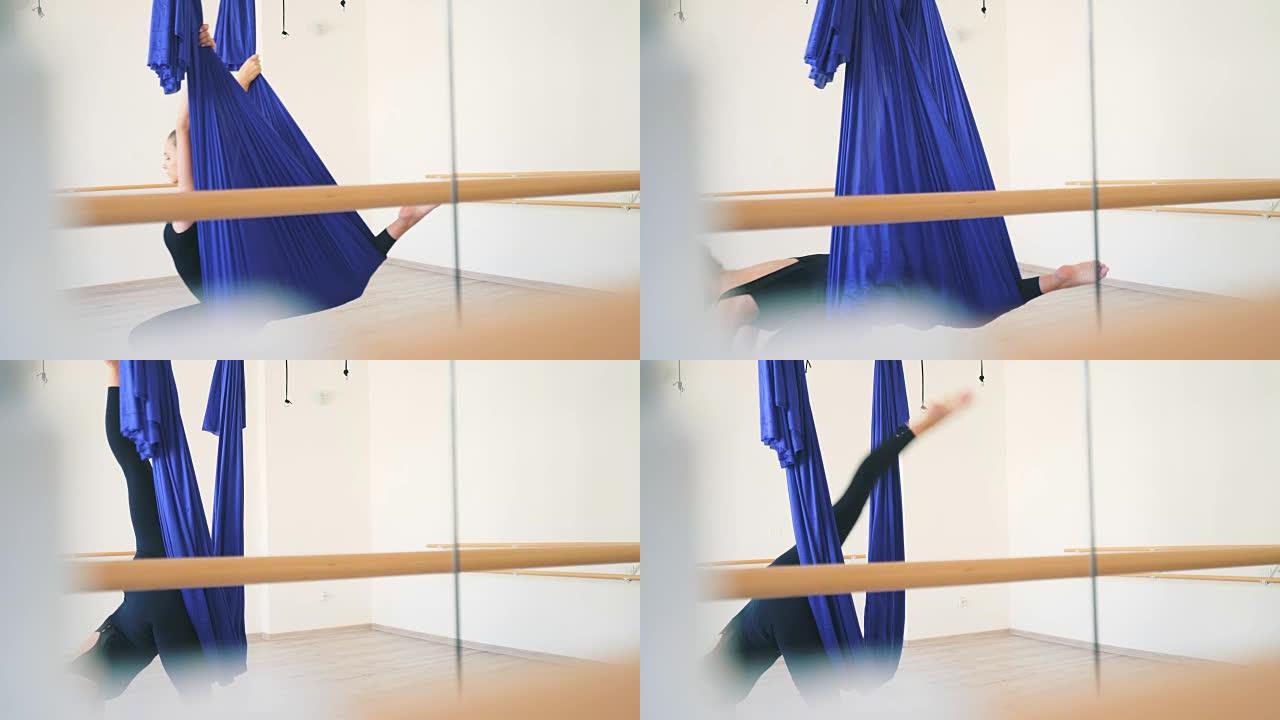芭蕾舞女演员用吊床练习。