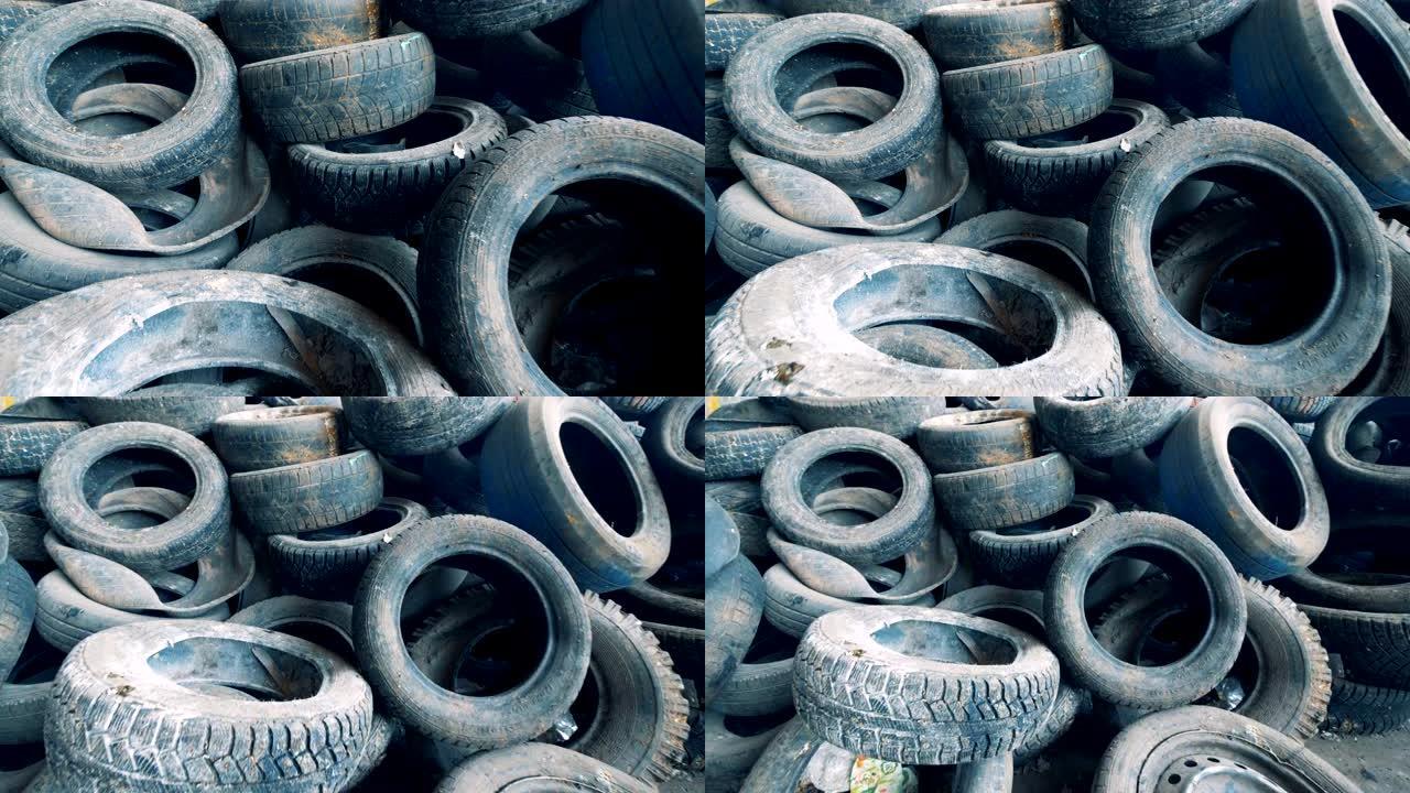 许多无用的浪费的机械轮胎堆积在俯视图中