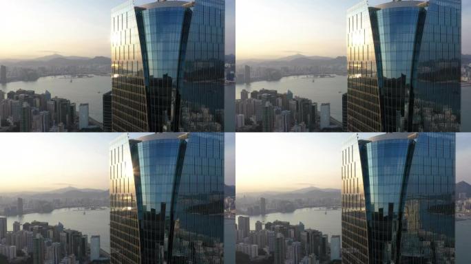 香港城市景观的鸟瞰图日出，具有现代建筑和建筑以及sunflares 4k股票视频。