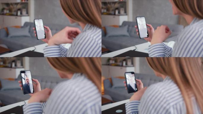 POV特写年轻金发女子使用智能手机互联网视频通话在自己的隔离上与朋友聊天。