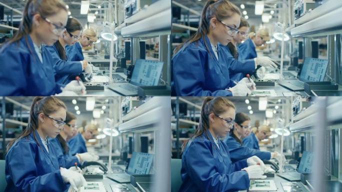 穿着蓝色工作服和防护眼镜的电子工厂女工正在用镊子和螺丝刀组装笔记本电脑的主板。拥有多名员工的高科技工