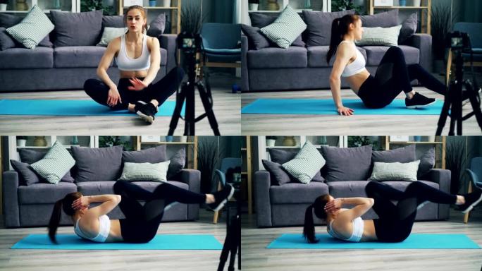 年轻女性博客作者在瑜伽垫上录制视频聊天和在家做运动