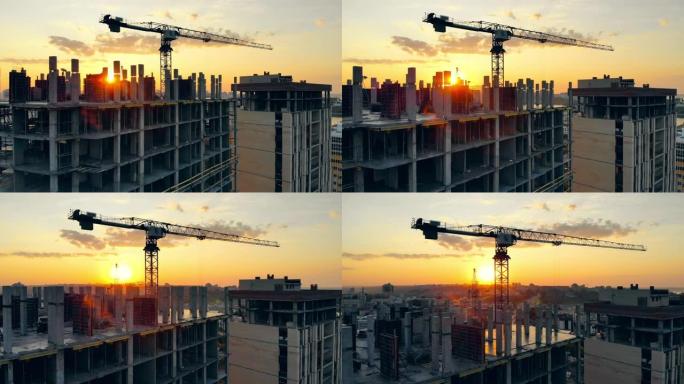 城市日落，起重机和多层房屋正在建造
