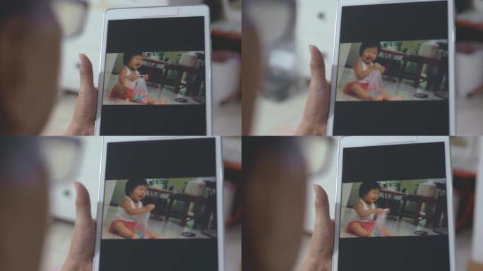 家庭视频: 祖母使用电子设备