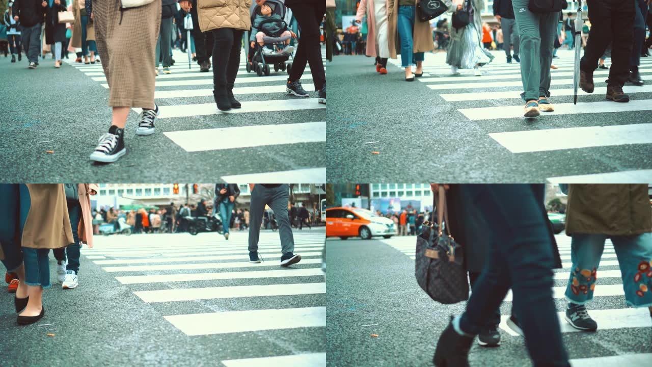 涩谷的人行横道行人脚步特写人行道上班族