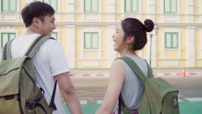 慢动作-旅行者亚洲夫妇在泰国曼谷旅行和散步，甜蜜的夫妇在假日旅行中度过甜蜜的时光感到快乐。生活方式夫