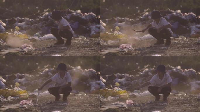 男孩蹲在垃圾场废弃荒废人文