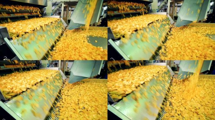 工厂输送机在特殊设施移动马铃薯薯片。