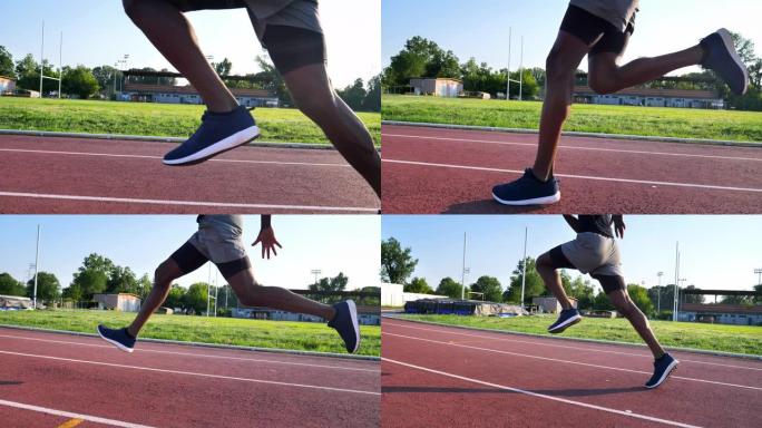 一名年轻的非洲男运动员的慢动作特写在阳光明媚的日子里在运动场的赛道上奔跑