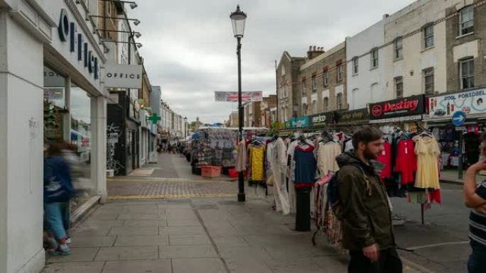 延时: 英国伦敦西部诺丁山跳蚤市场的行人人群