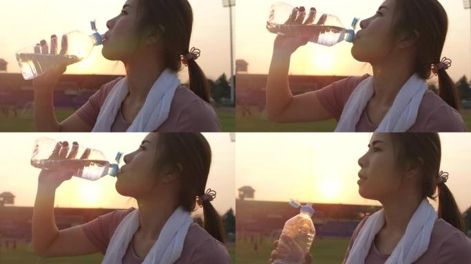 运动妇女饮用水清晨晨练补充水分慢镜头