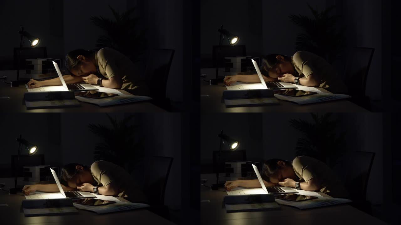 忙碌的女人在黑暗的办公室空气之夜工作