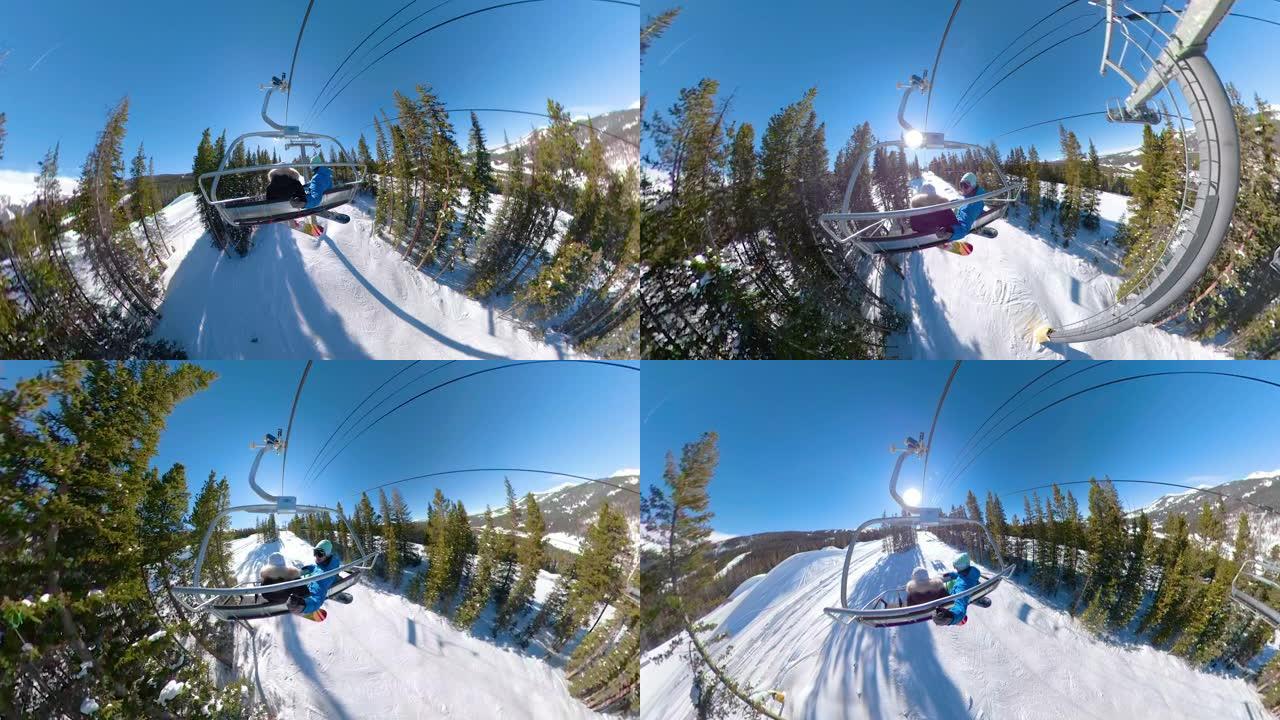 自拍照: 科罗拉多州活跃的情侣单板滑雪享受风景优美的升降椅之旅。