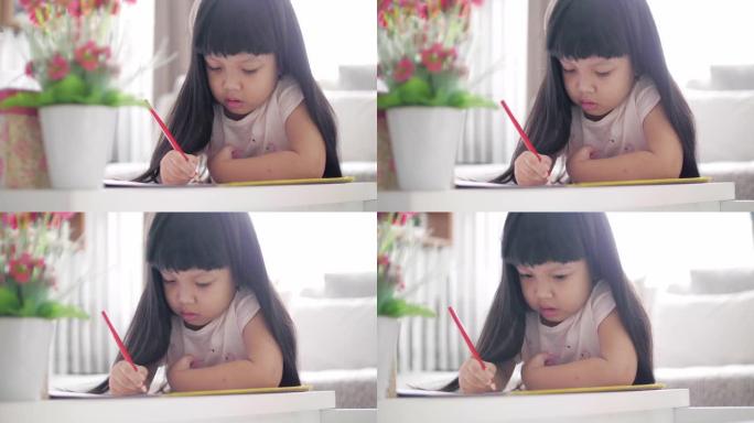 慢动作: 小女孩在假期在家写画和绘画