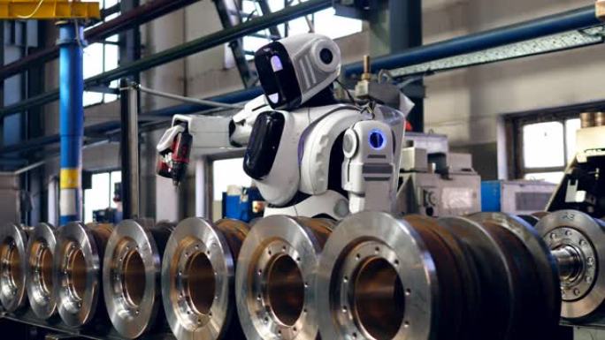 白色机器人使用螺旋枪处理工厂细节。