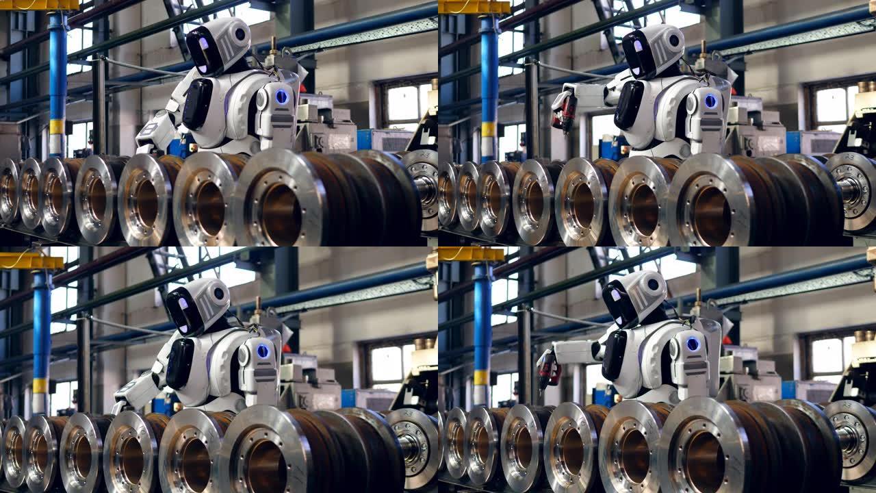 白色机器人使用螺旋枪处理工厂细节。