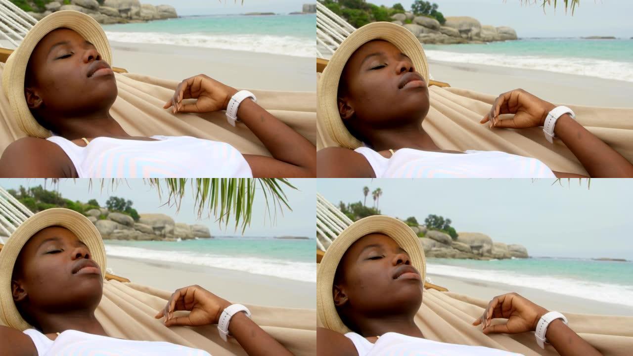 睡在海滩吊床上的非洲裔美国妇女的前视图4k
