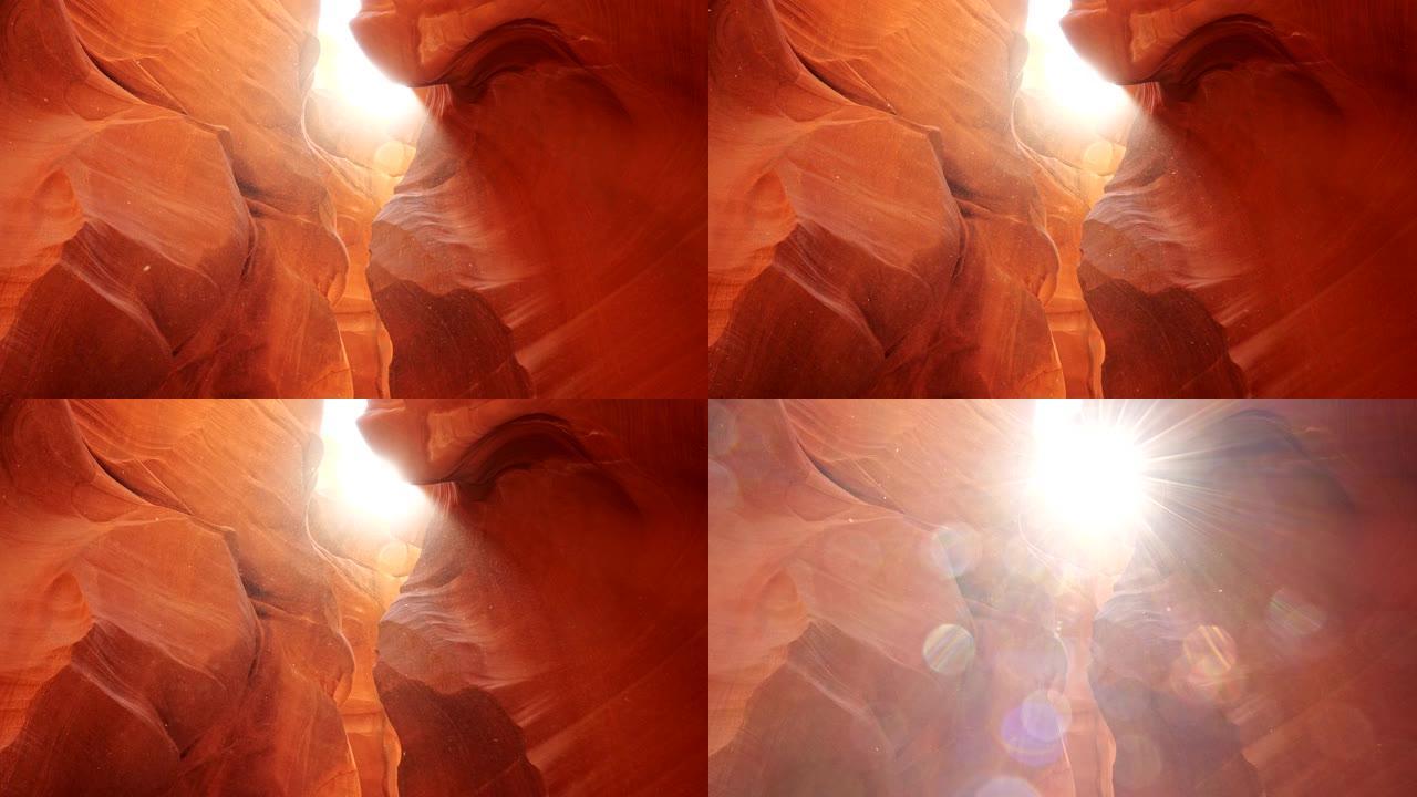 美国羚羊峡谷橙色岩石周围漂浮的灰尘。阳光穿过，到处闪耀。Steadicam镜头，4K