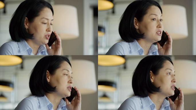 亚洲女性在电话中交谈的面孔
