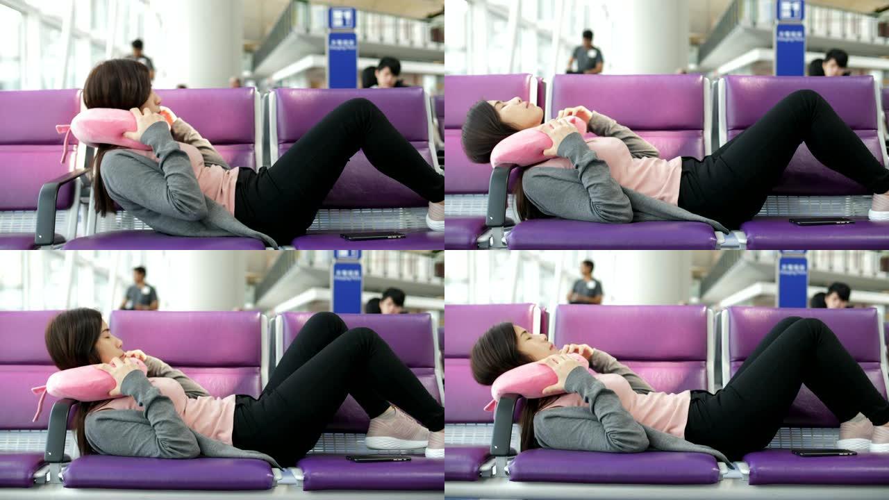 在机场睡觉的女人延误等待休息