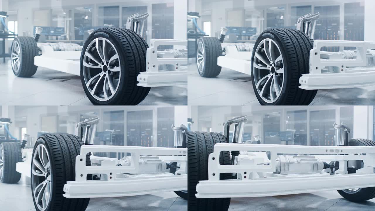 位于高科技工业机械设计实验室的正品电动汽车平台底盘原型概念。混合动力车架包括轮胎、悬架、发动机和电池