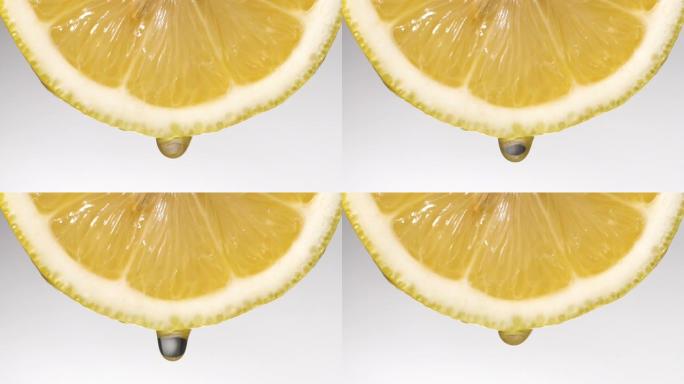 慢动作: 一滴柠檬片上的白色液体
