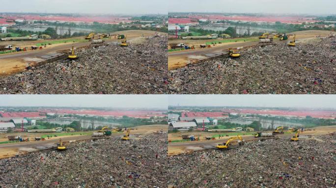 垃圾车的鸟瞰图在垃圾填埋场或垃圾场移动垃圾，污染，全球变暖