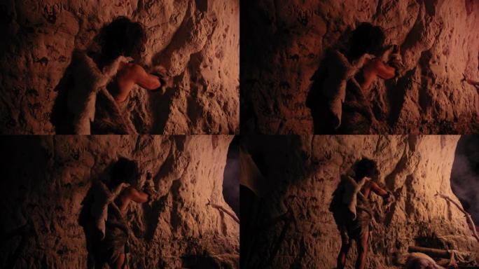原始的史前尼安德特人穿着动物皮在夜间绘制动物并在墙壁上抽象。用岩画创作第一个洞穴艺术，岩画被火照亮。
