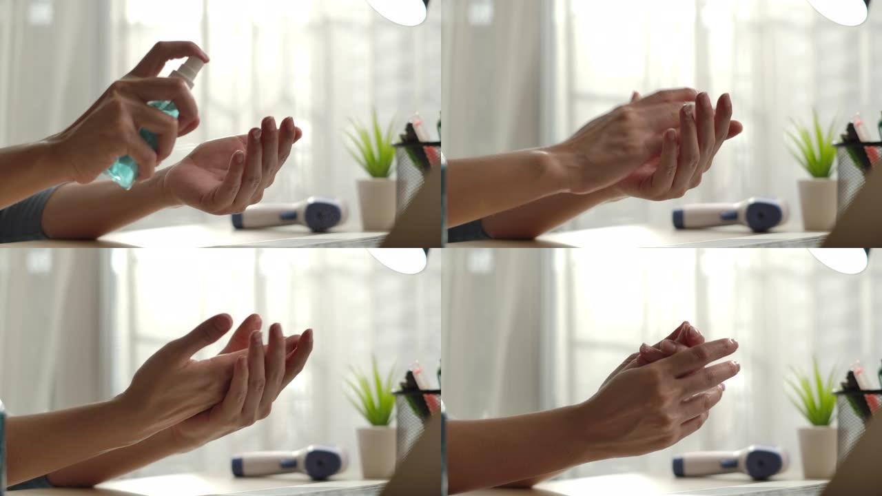 使用洗手液喷雾的特写女人用酒精喷雾清洁她的手