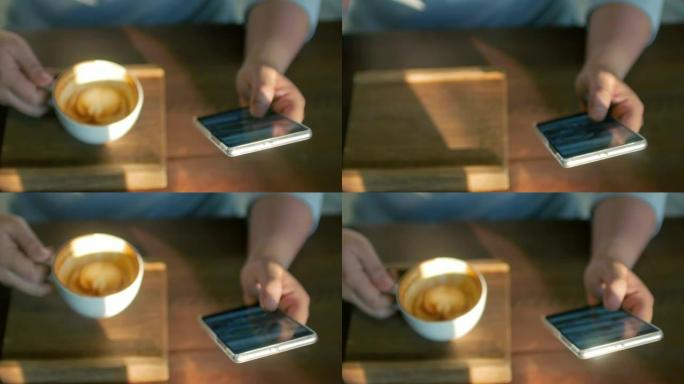 女人在咖啡馆里用手机喝咖啡