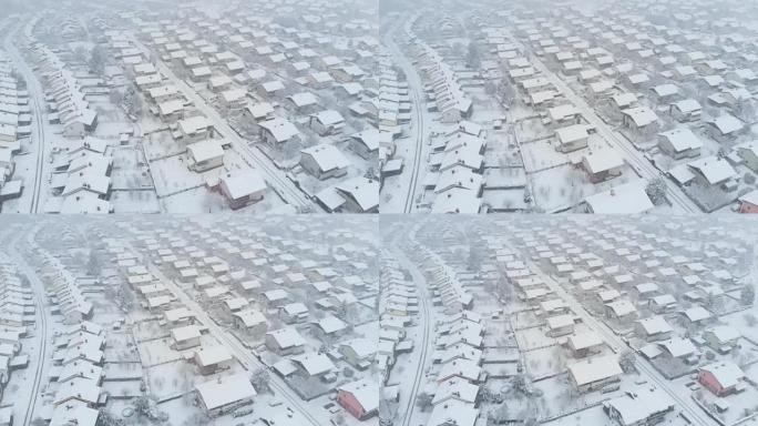 空中: 原始的白雪覆盖了郊区社区的空旷街道。