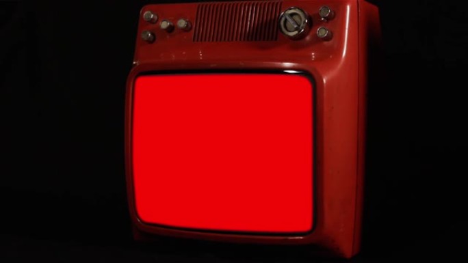 带有红色色度背景的古代红色电视。您可以用所需的素材或图片替换红色屏幕。