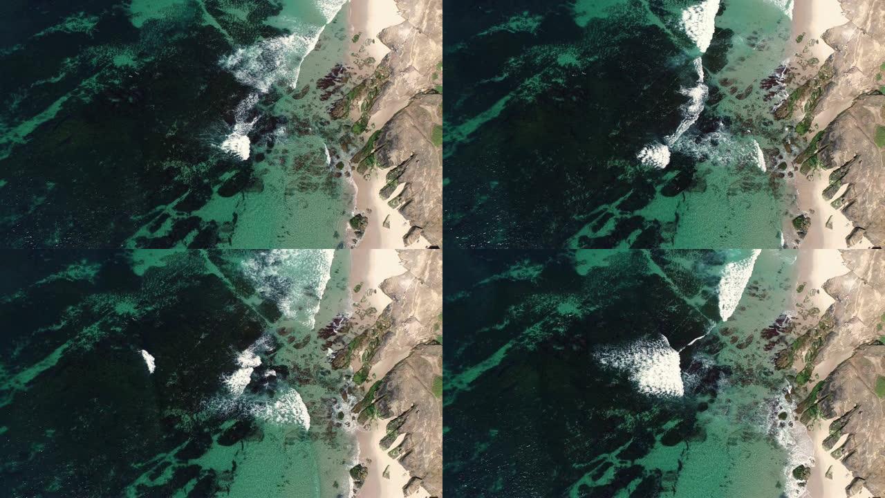海浪撞击海岸线的俯视抽象鸟瞰图