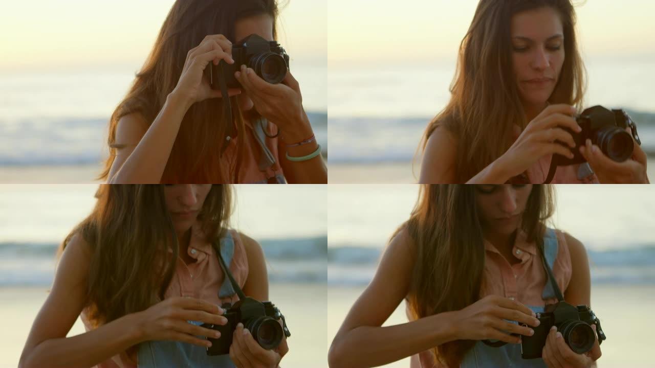 女人在海滩上用相机拍照4k