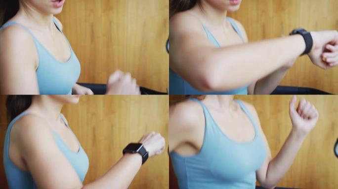 女人在家在跑步机上锻炼，检查智能手表