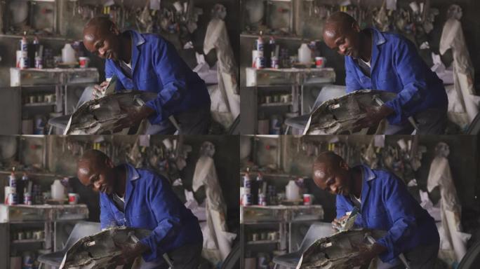 非洲男子打磨汽车