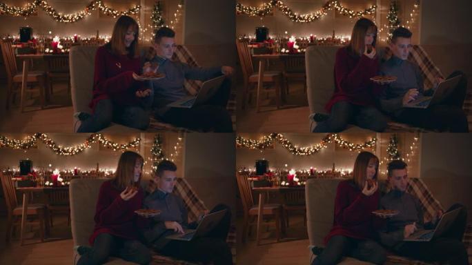 圣诞节晚上，年轻夫妇在舒适的氛围中在家。
