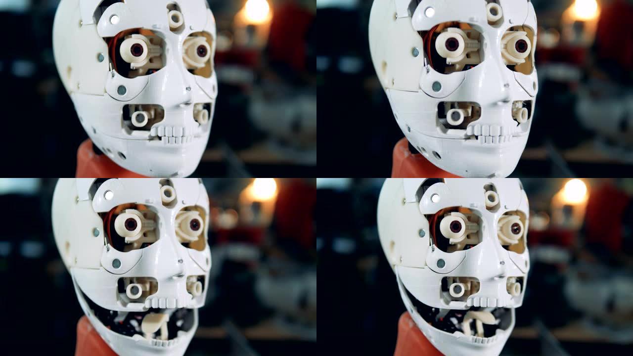 机器人头部移动眼睛和张开嘴，特写。