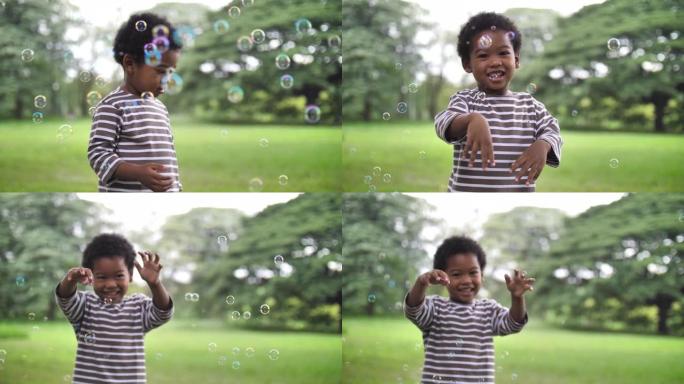 非洲男孩在公园玩泡沫