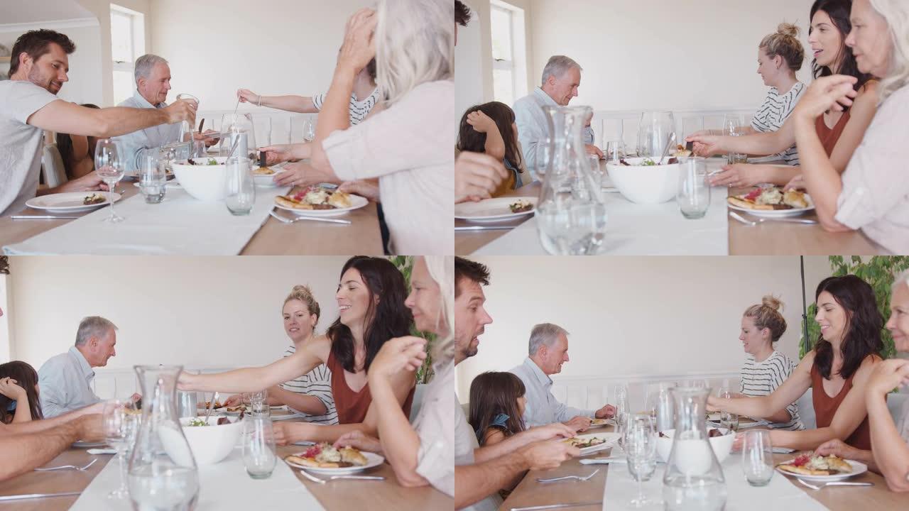 多代家庭坐在一起吃饭