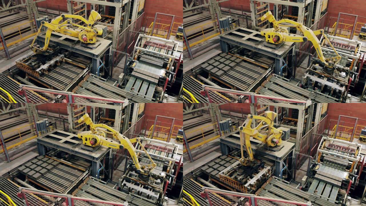 机械化，自动化的机械臂正在现代工厂搬迁陶瓷产品