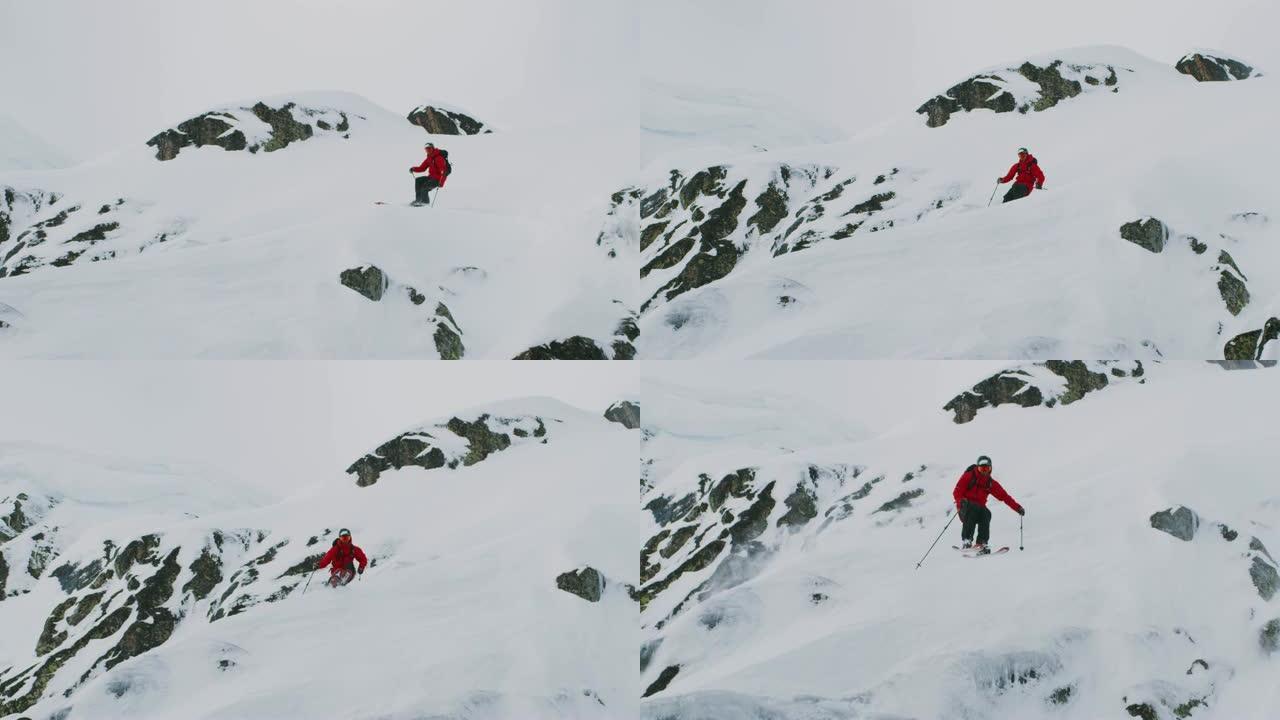 滑雪者在偏远地区跳下悬崖