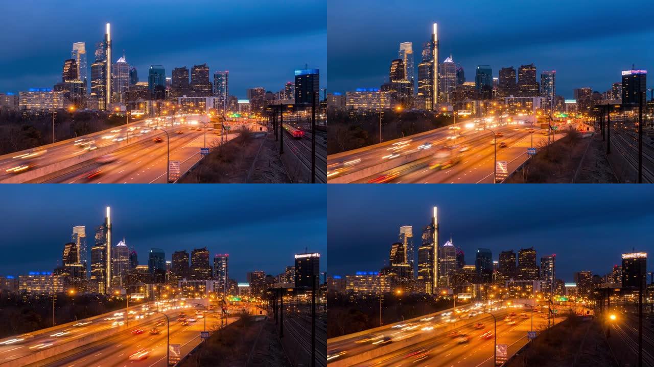 延时: 美国宾夕法尼亚州黄昏日落时的费城高速公路和天际线摩天大楼的城市景观