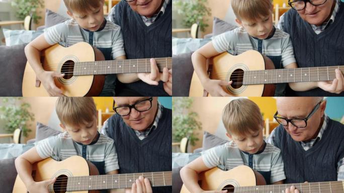 老人教孙子在公寓里弹吉他