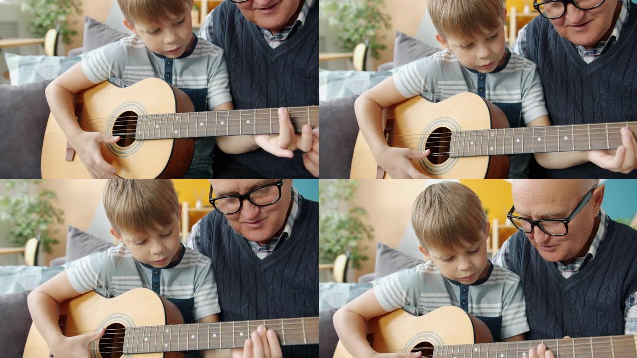 老人教孙子在公寓里弹吉他