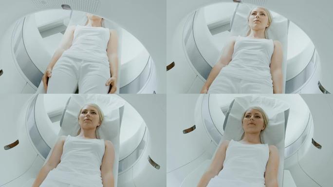 在医学实验室中，男性放射科医生对接受手术的女性患者进行MRI或CT或PET扫描。高科技现代医疗设备。