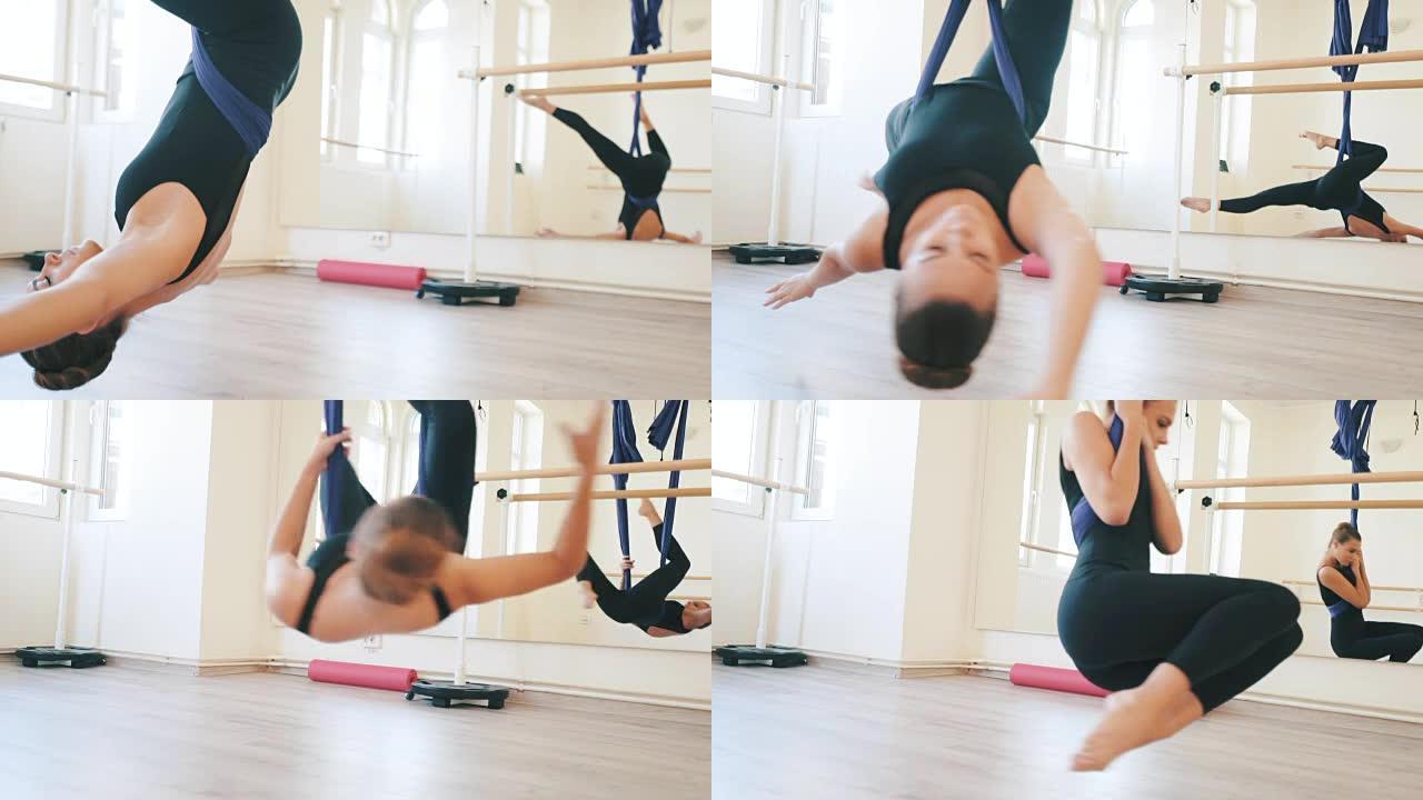 练习空中芭蕾。瑜伽吊绳高难度动作