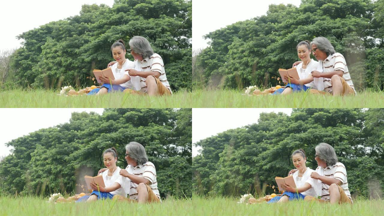 高级夫妇，夫妻俩在公园野餐，心情愉快。有生活方式、退休年龄和爱情的人。