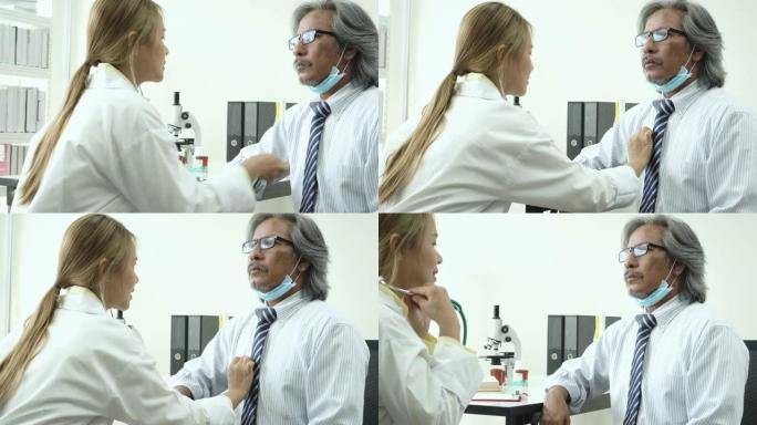 4k dolly shot: 亚洲医生将听诊器与患者一起治疗
