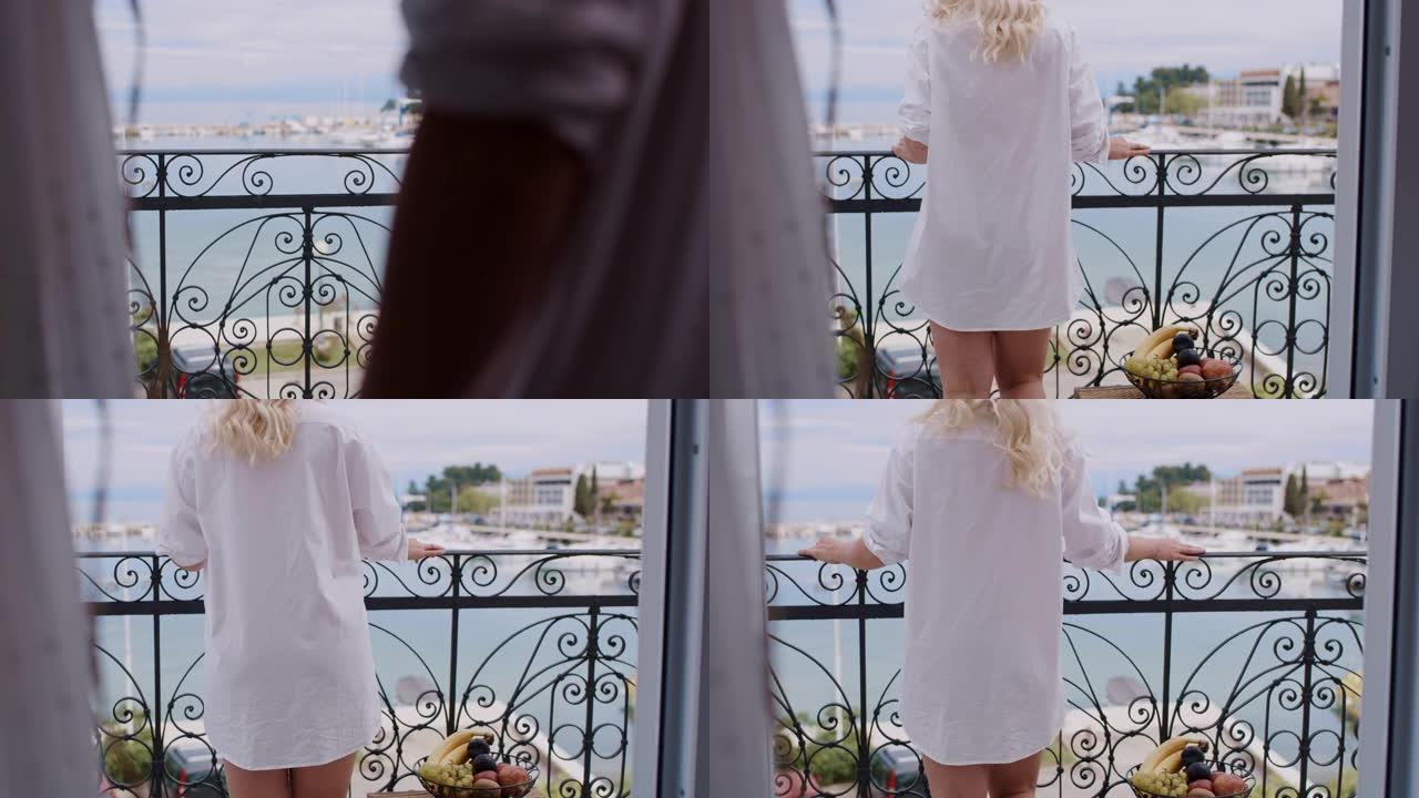 穿着白衬衫的WS女人在海边的阳台上行走